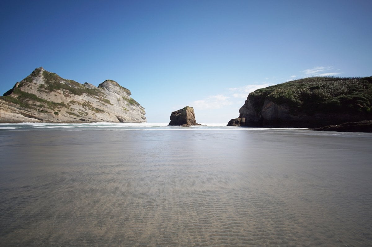 Hier kommt die Flut, Wharariki Beach, NZ