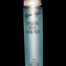 Sparkling Zircon gemstones encircling the perfume bottle.